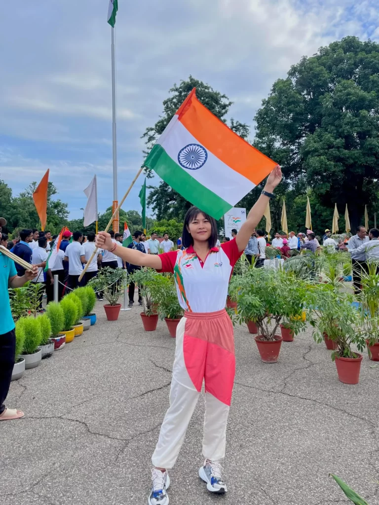 Jamuna Boro holding Indian Flag